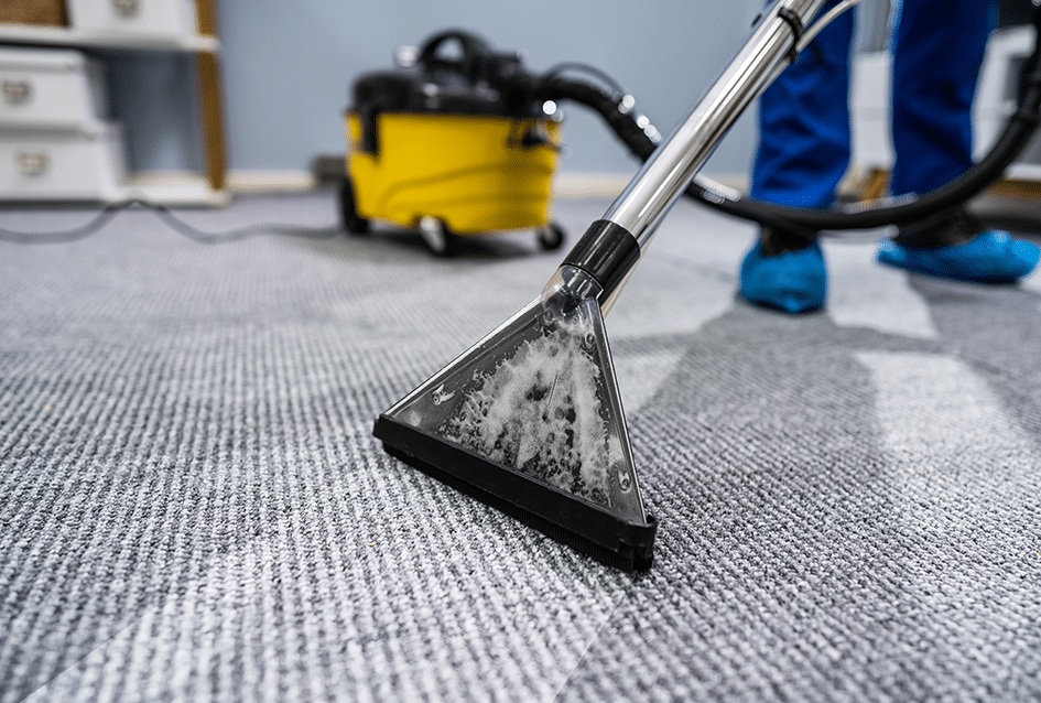 Cleaner nozzle in focus on carpet