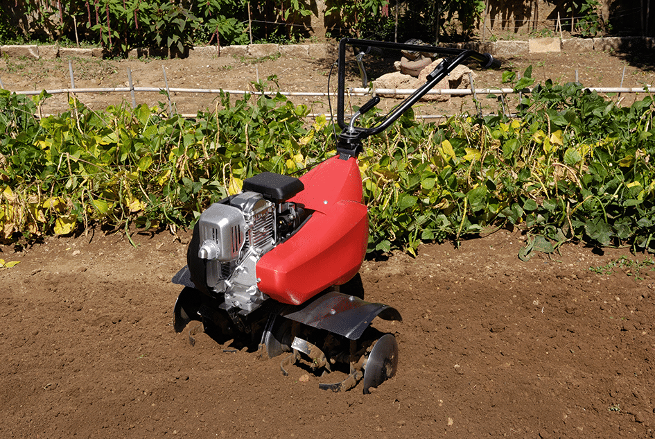 Pedestrian Rotavator on soil