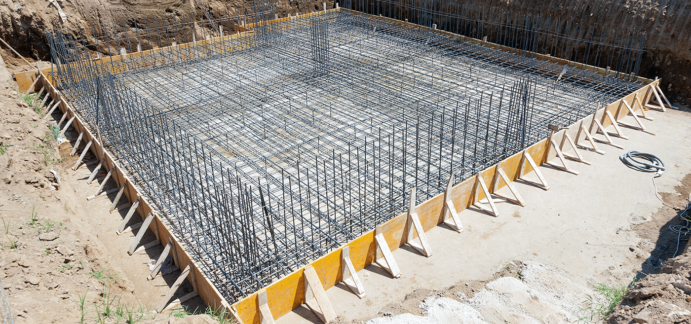 Metal rebar enclosed by shuttering